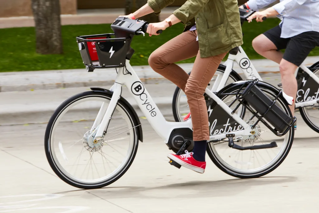 person riding a BCycle bike share bicycle