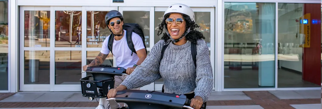 happy people having fun on bike share bicycles